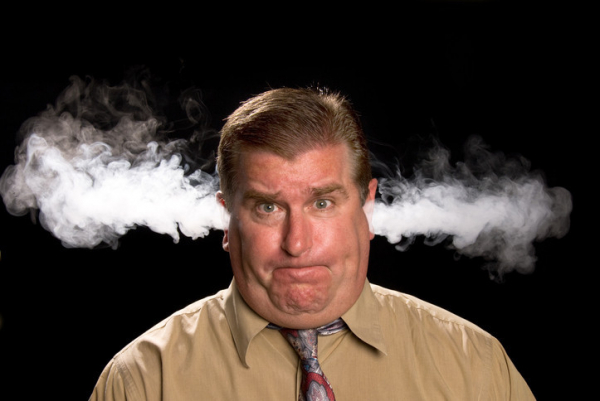 Angry man venting steam from his ears